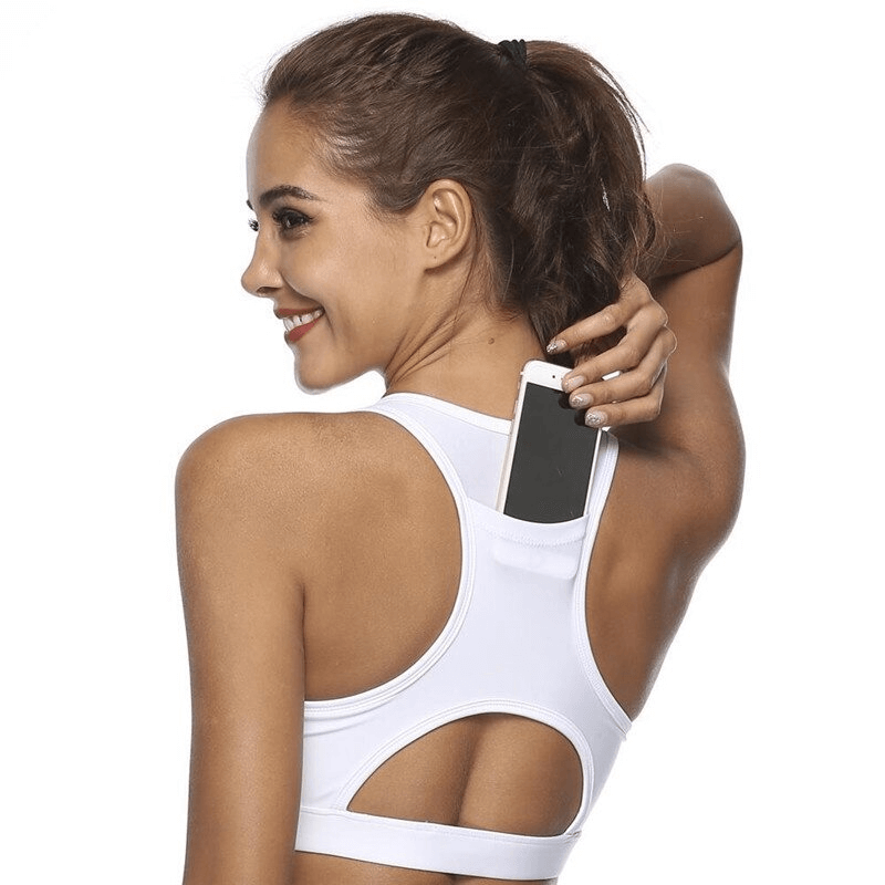 Woman wearing a stylish elastic sports bra with a handy back pocket for holding a phone, perfect for female fitness enthusiasts.